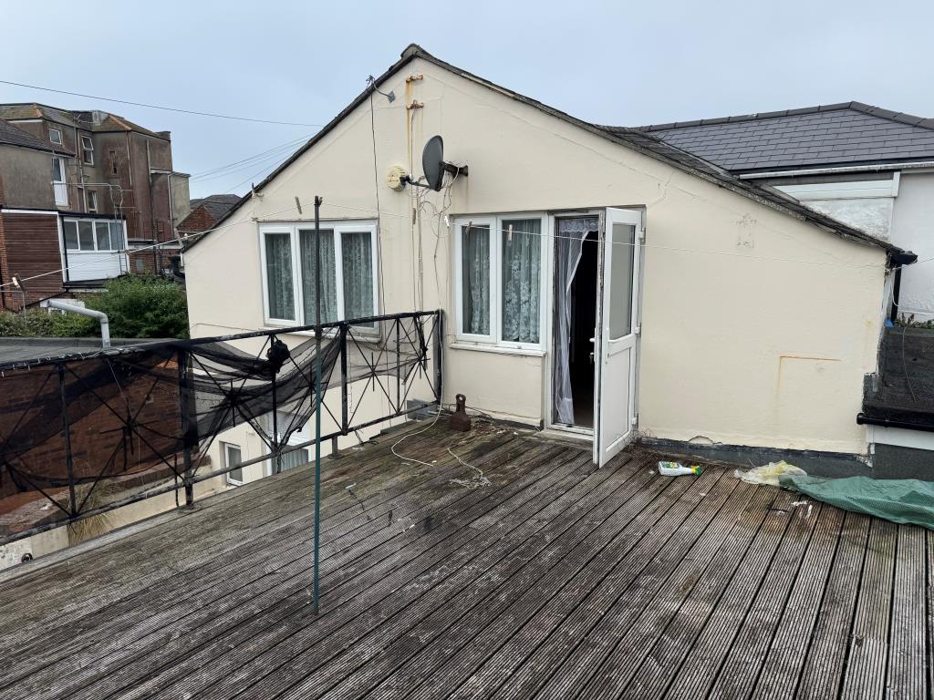 Lot: 118 - THREE-BEDROOM HOUSE FOR IMPROVEMENT - Looking Back Across the Decked Area to the House